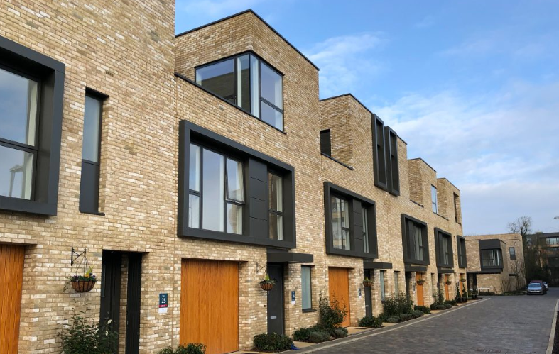 Black, powder coated aluminium window pod on new brick houses