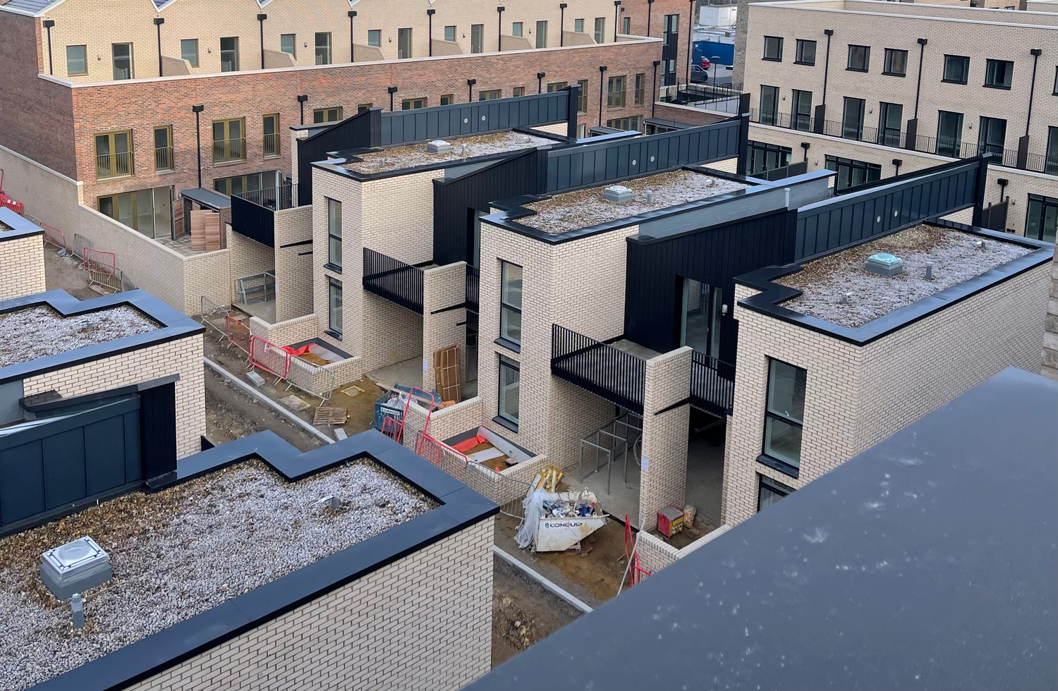 Black, powder coated aluminium coping on new build apartments